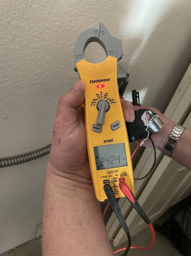 Voltage testing with clamp meter during Electrical Installation Services in Sycamore